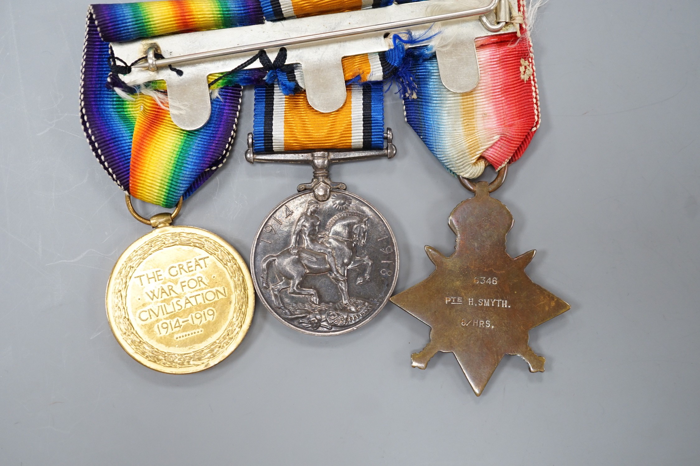 A WWI Mons star (with later bar) trio to 6346 PTE. H. SMYTH 8/HRS.